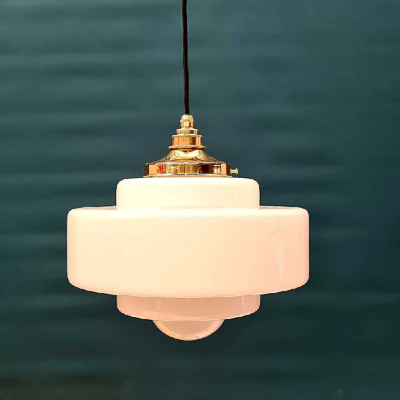 The Deco Opal School light is a beautiful pendant that exudes elegance. Its opal glass radiates a soft, pure white glow, creating a serene ambiance.